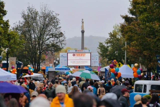 People at the downtown Franklin festival PumpkinFest, kids activities, live music, fall food and drink, costume contest for pets and families, and outstanding arts and crafts featuring seasonal and specialty gift items.