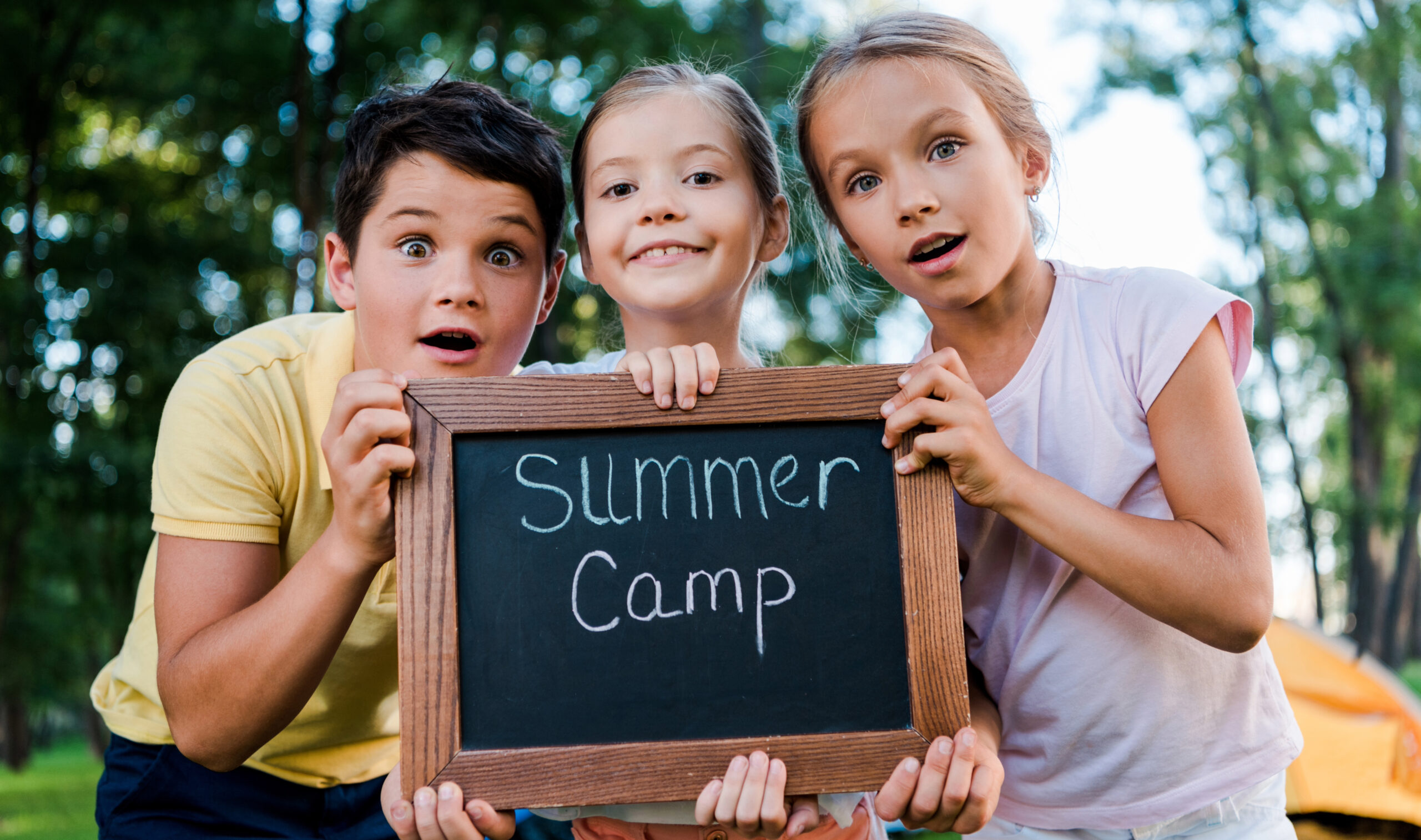 Kids Holding Summer Camp Sign for summer camp in Franklin, Williamson County, TN.