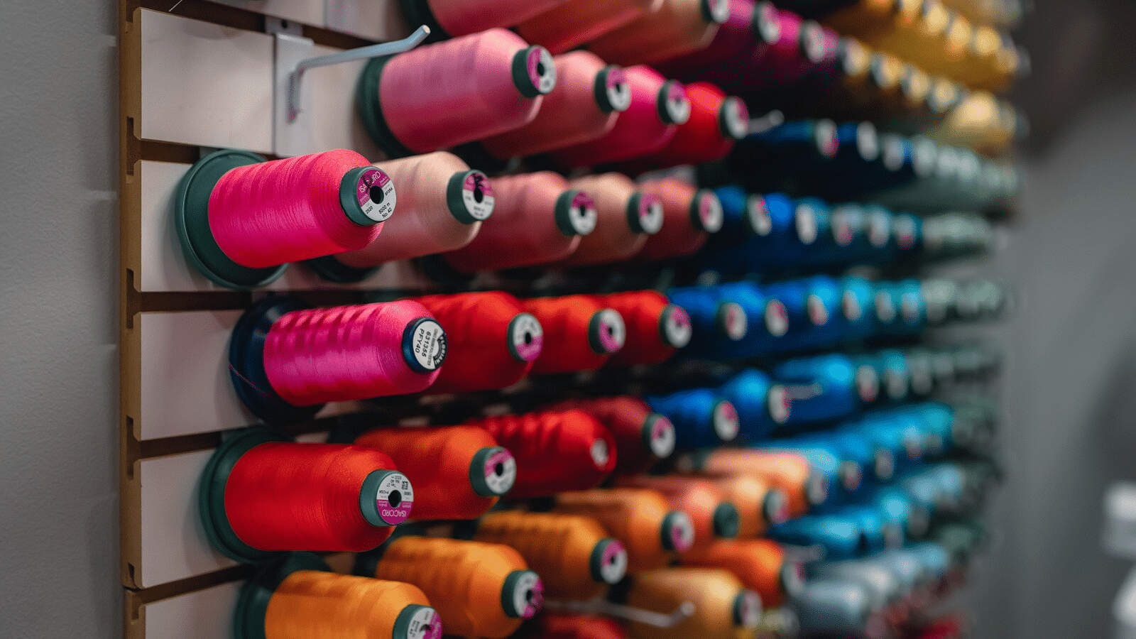 Thread spools, the Purple Butterfly Children’s Boutique in Downtown Franklin, TN, shop apparel, gifts, shoes, toys, bows, and more.