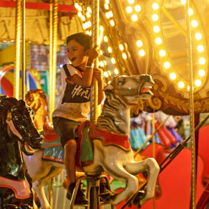 The Nashville Fair-kids on a carousel.