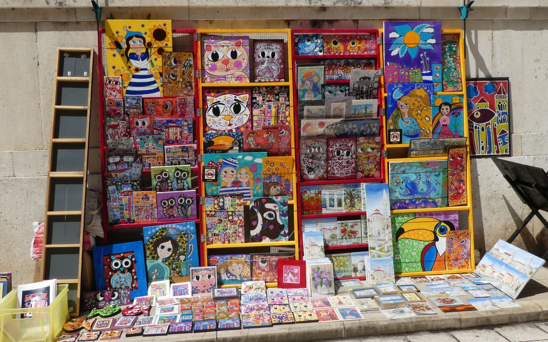 Artwork and paintings on display in downtown Franklin, Tennessee by a local vendor.